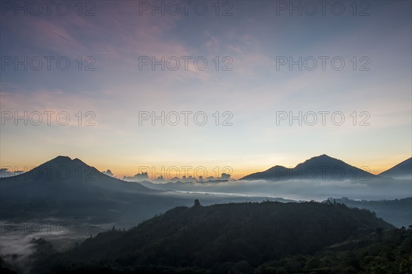 Hilltops over morning fog in remote landscape