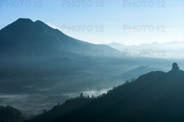 Mountains and morning fog in remote landscape