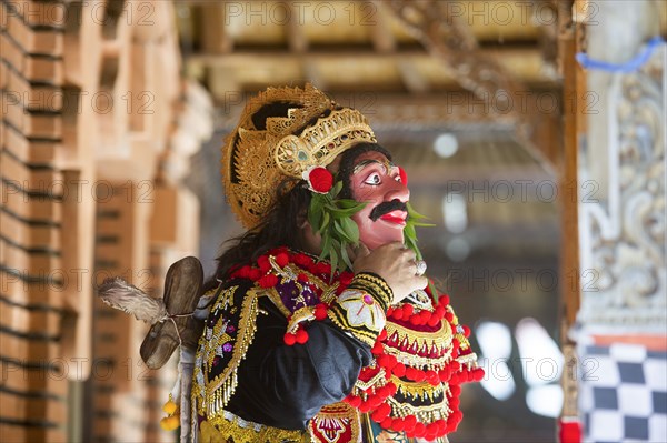 Traditional dancer standing in Buddhist temple