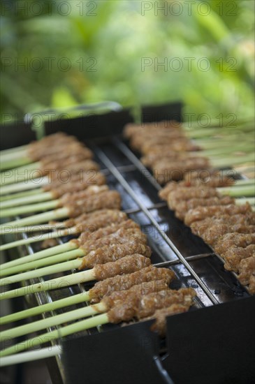 Close up of food cooking on grill outdoors