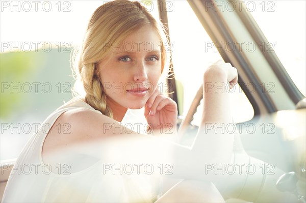 Caucasian woman sitting in car