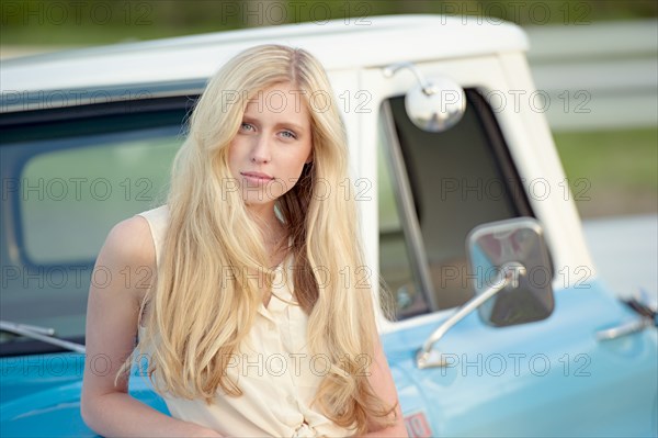 Caucasian woman standing near truck