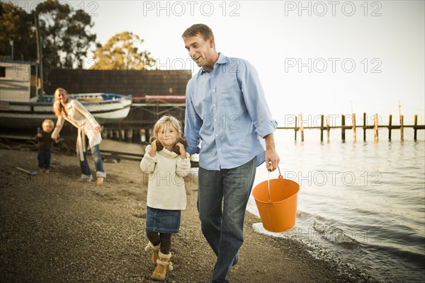 Caucasian family enjoying the beach