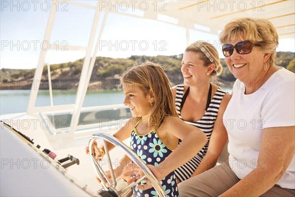 Family enjoying boat on lake