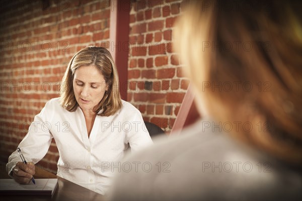 Caucasian businesswoman working in office