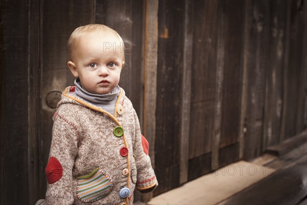 Caucasian boy standing outdoors