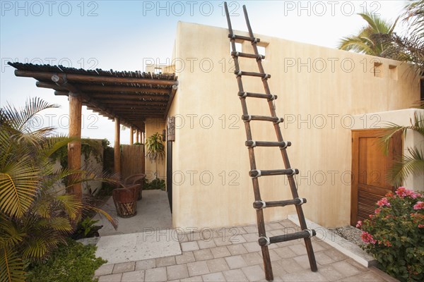 Ladder on Mexican style home