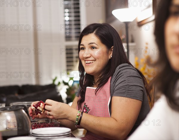 Hispanic family preparing Thanksgiving dinner