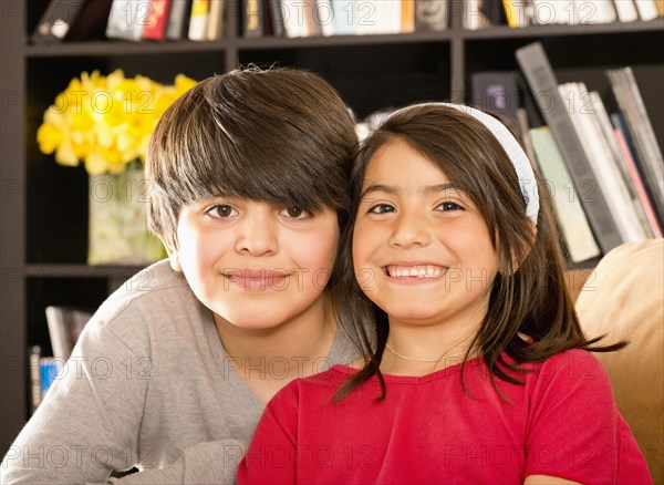 Smiling Hispanic brother and sister