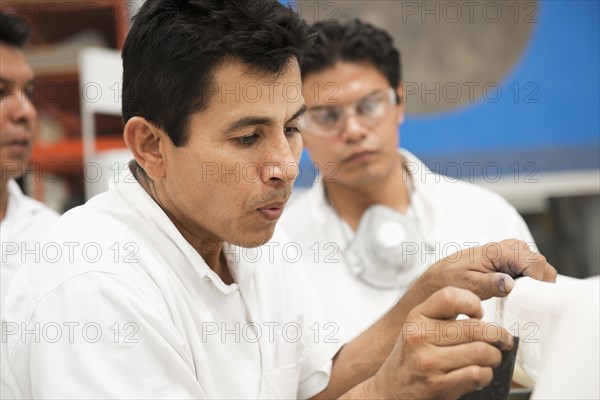 Men working in manufacturing plant