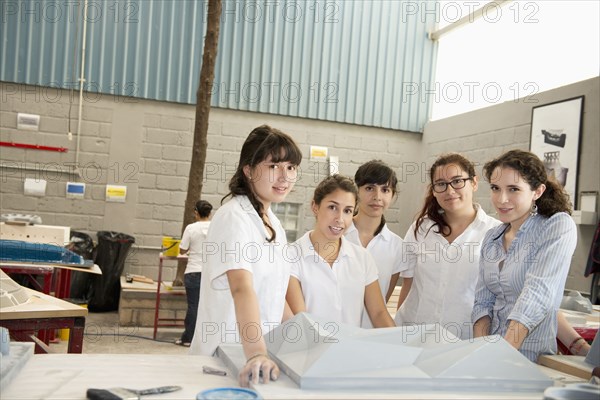 Workers talking in manufacturing plant