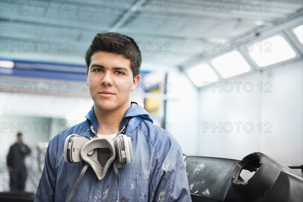 Worker smiling in manufacturing plant