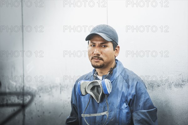 Worker standing in manufacturing plant