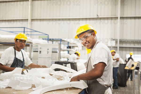 Men working in manufacturing plant