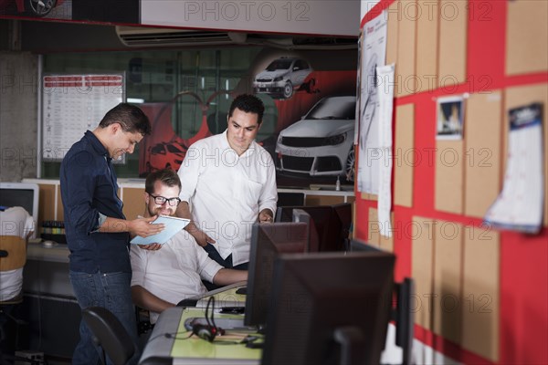 Businessmen talking in office