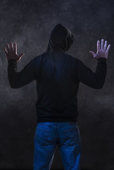 Caucasian man wearing black hoodie