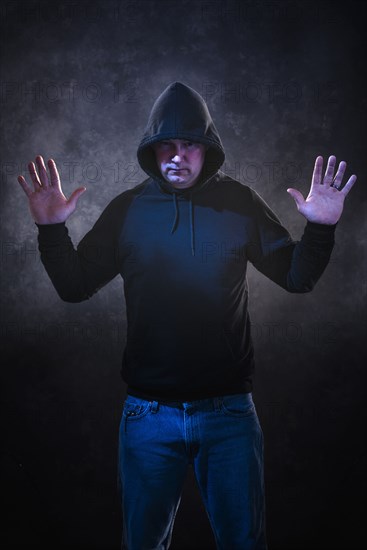 Caucasian man wearing black hoodie