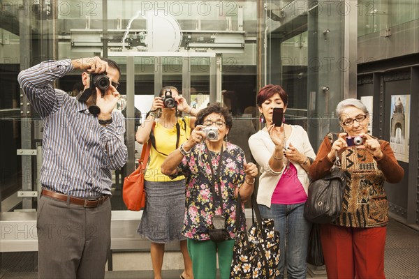 Tourists taking pictures in museum