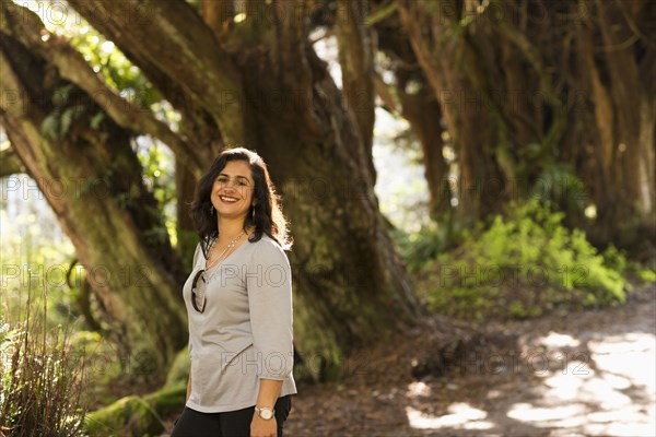 Hispanic woman walking outdoors