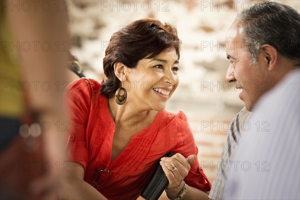 Hispanic couple talking outdoors