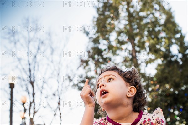 Hispanic girl gasping outdoors