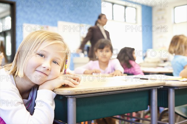 Caucasian student smiling in class