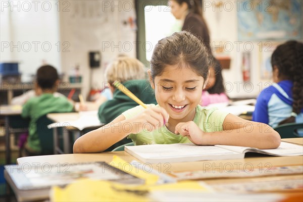 Hispanic student working in class