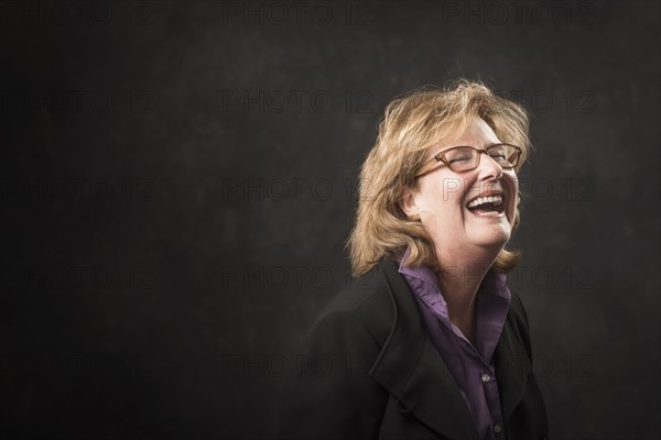 Caucasian businesswoman laughing