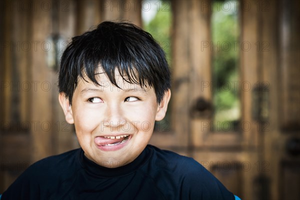 Hispanic boy making face