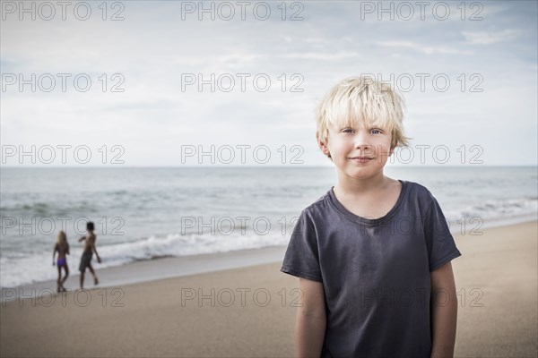 Boy smiling on beach