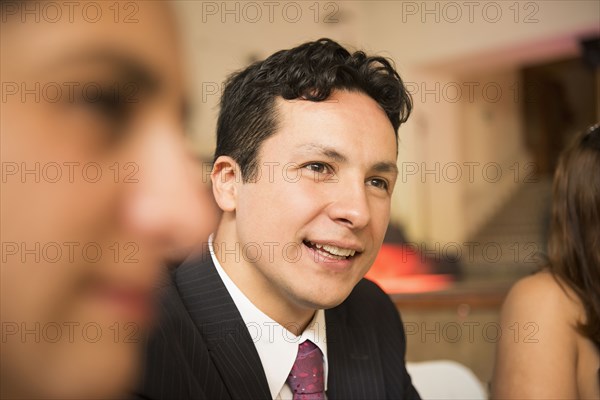 Hispanic family at wedding reception