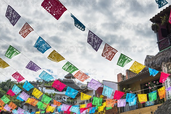 Prayer flags hanging over town streets