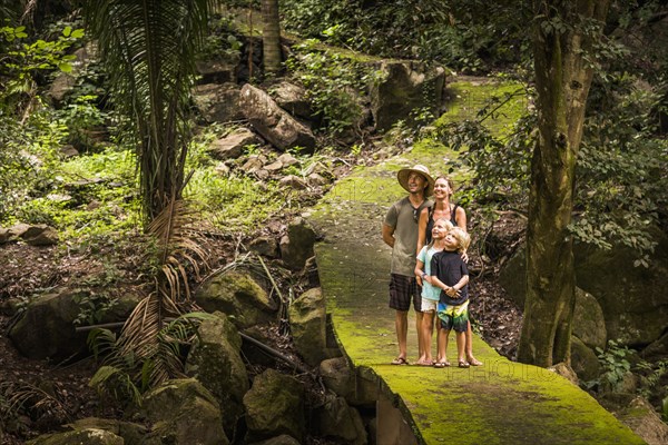 Caucasian family exploring jungle