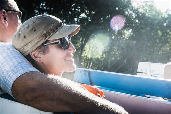 Couple relaxing in boat