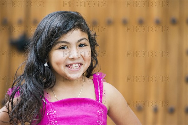 Hispanic girl smiling outdoors