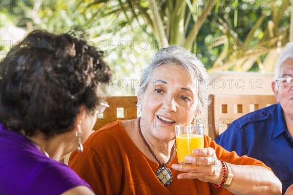 Hispanic women talking at table