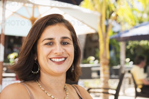 Hispanic woman smiling outdoors