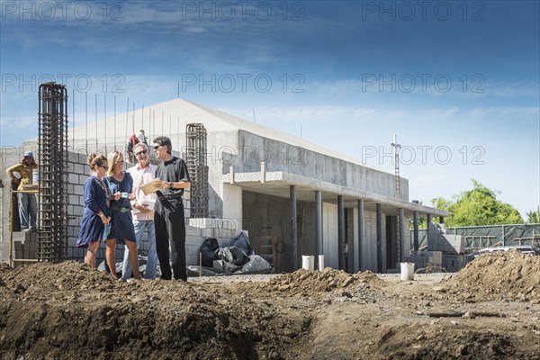 People talking at construction site