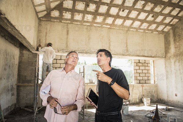 Men talking at construction site