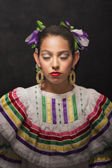 Hispanic teenage girl wearing Sinaloa Folkloric dress