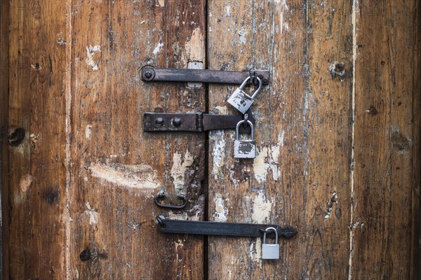 Close up of padlocks on secure door