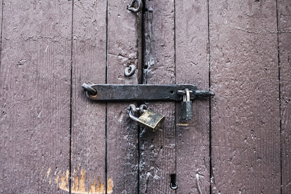 Close up of padlocks on secure door