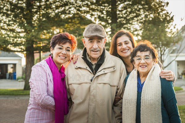 Hispanic Multi-generation family smiling outdoors
