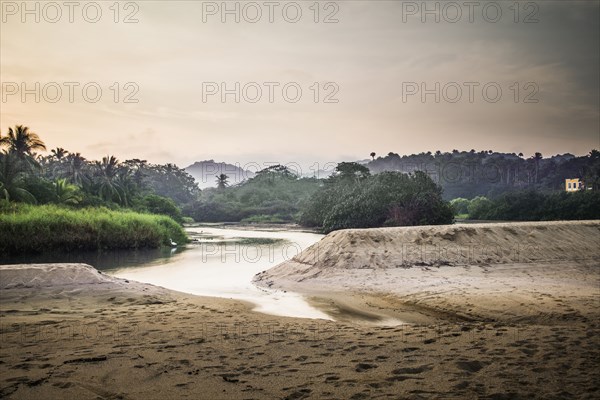 Sandy beach and lake in jungle