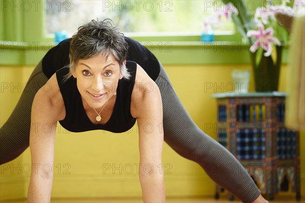 Older Caucasian woman practicing yoga