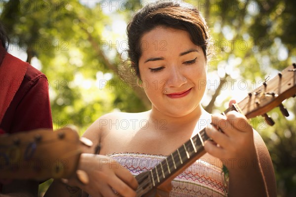 Hispanic musicians performing in park