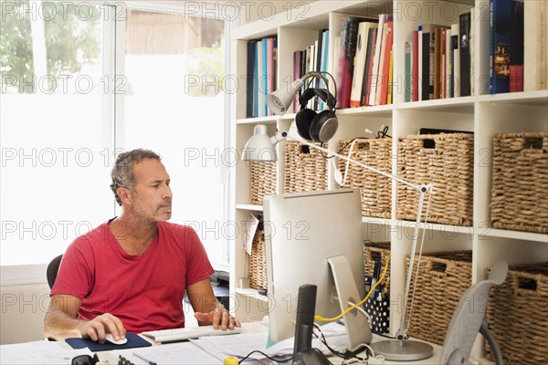 Hispanic man working in home office