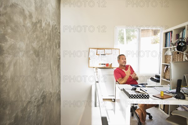 Hispanic man working in home office