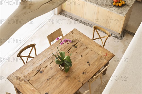 High angle view of dining table and chairs in kitchen