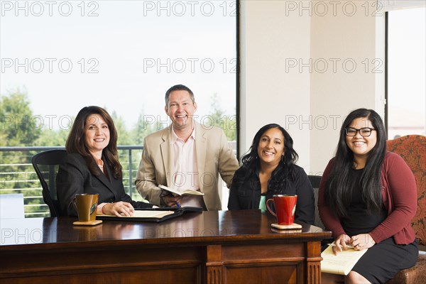 Business people smiling in office